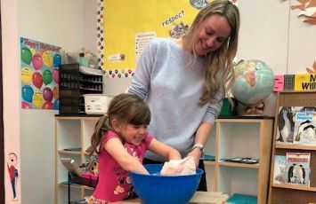  student and teacher do a hands on project